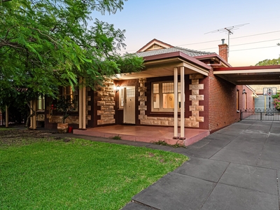 Leafy Serenity: Character-Rich Bungalow With Historic Charm And Modern Convenience