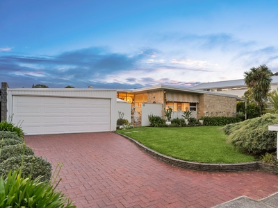 Indulge in the epitome of luxury living with this exceptional mid-century stunner