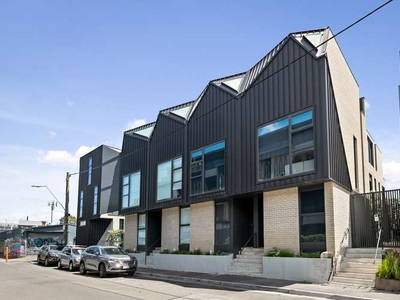 North Facing designer townhome with rooftop terrace, CBD views in the heart of Richmond.