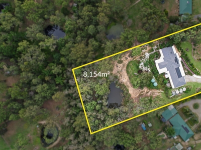 Acreage Bliss: 2 Acres, 6 Bedrooms - A Property Beyond Compare!