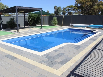 Brick home with a Sensational Pool!