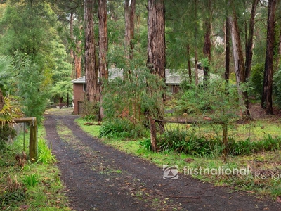 LARGE 4 BEDROOM BRICK HOME ON OVER ½ ACRE WITH TWO GARAGES.