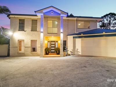 Gorgeous Family Residence with Expansive Living Spaces, Pool and Option for a 6th Bedroom!